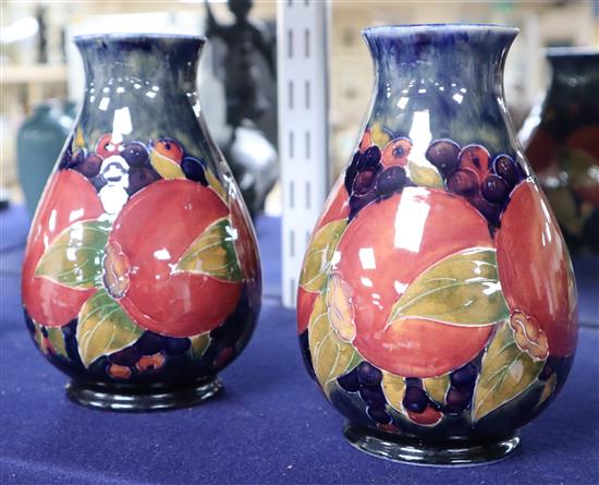 A pair of Moorcroft pomegranate vases, height 16cm